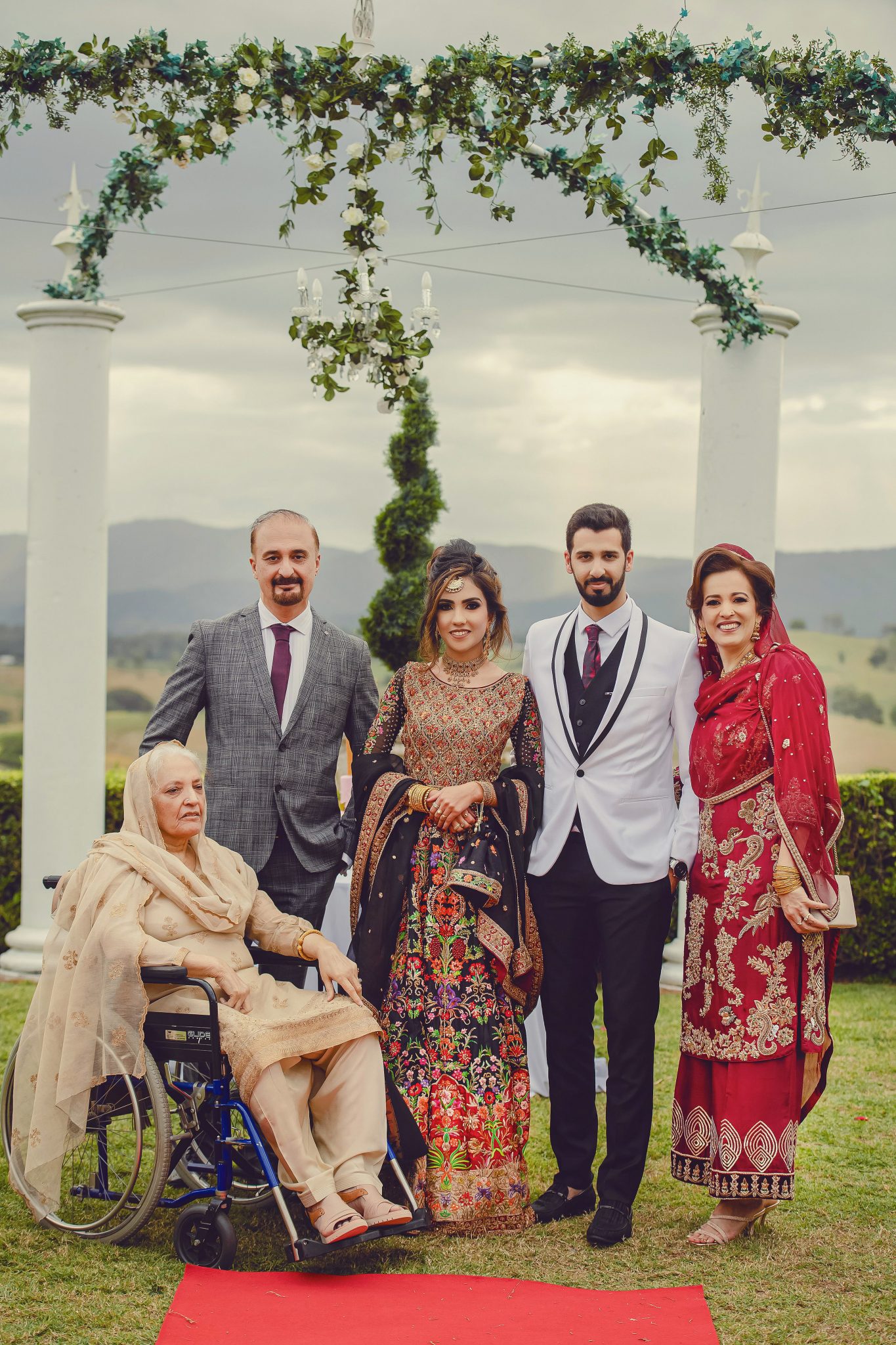 The Groom and Bride with their parents during photoshoot