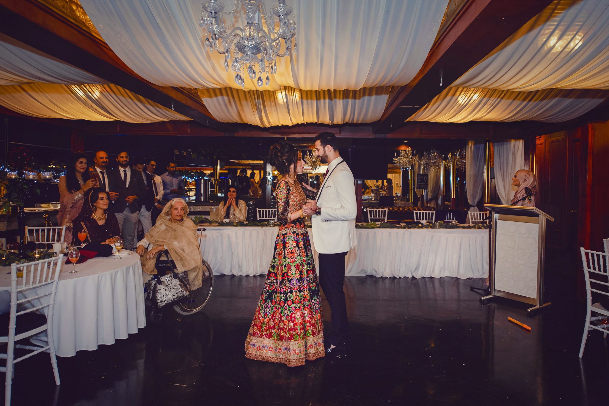 A Groom and the Bride are dancing together during reception
