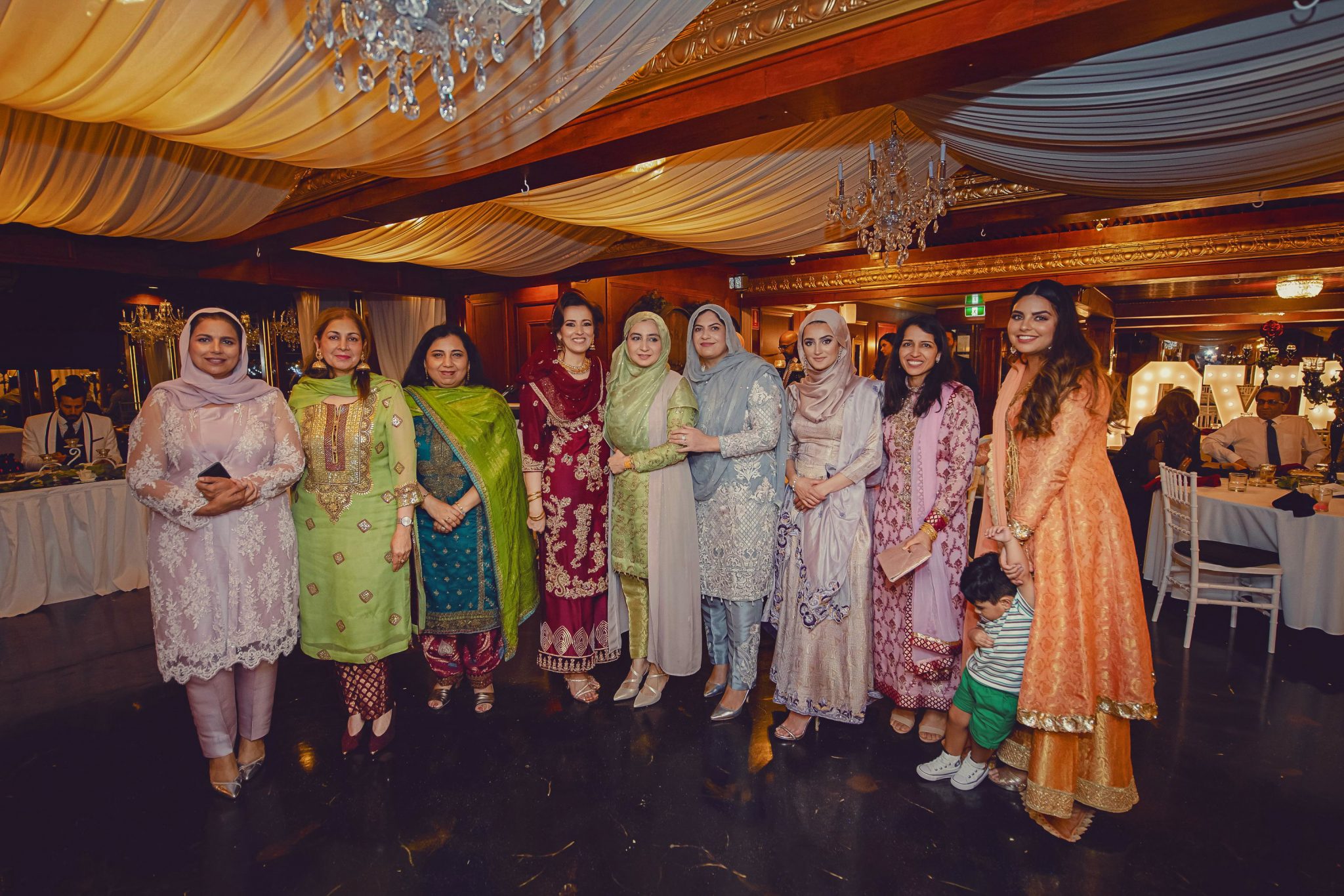 All girls smiling to the camera during the reception