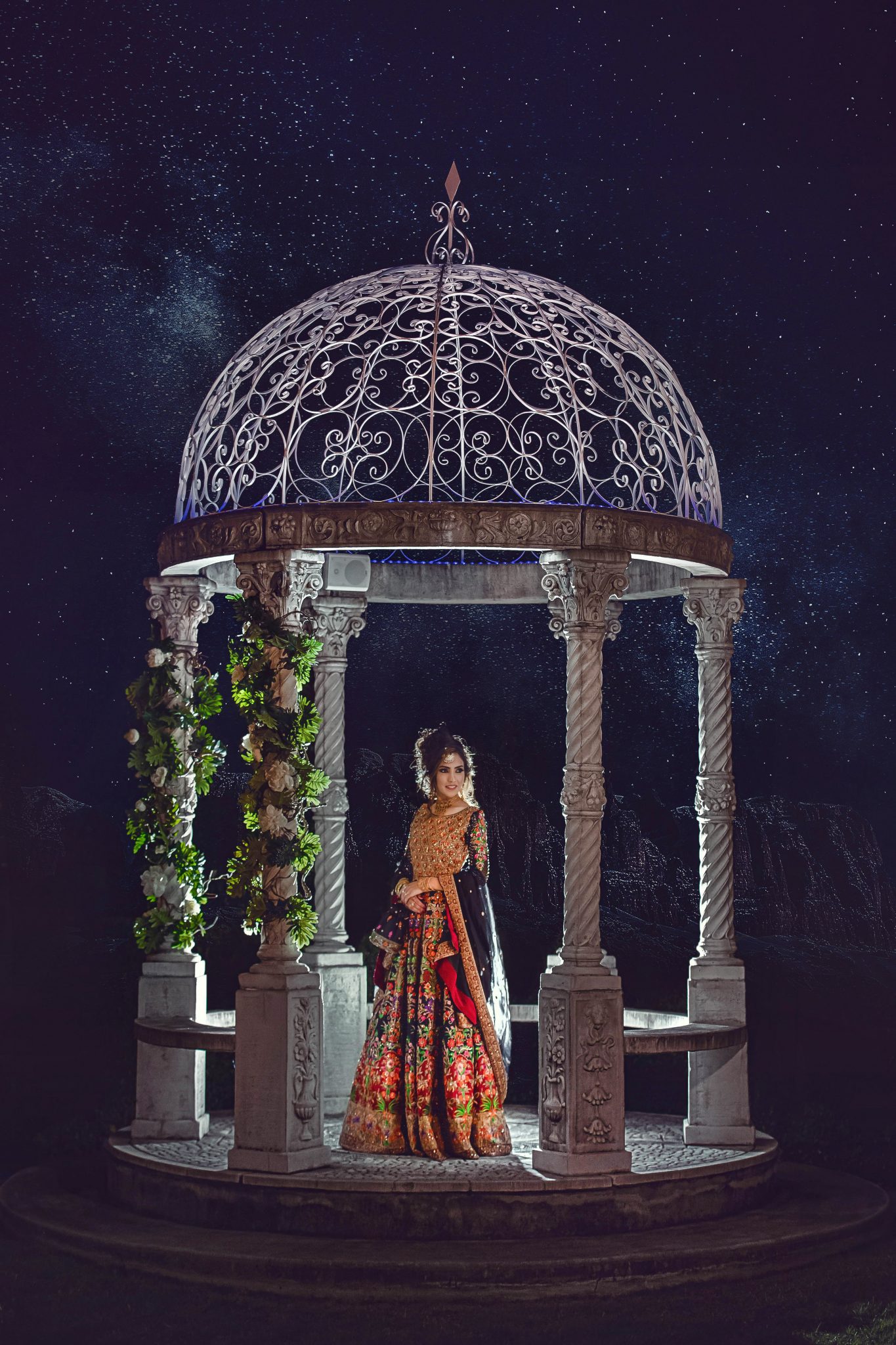 A bride standing on a small wedding house with a background of starry night