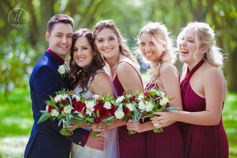 bride and groom with their bridesmaids
