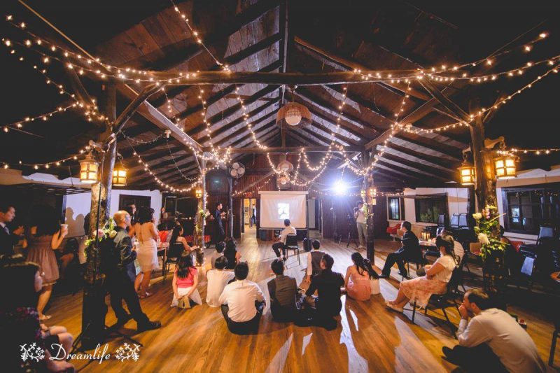 cabin like wedding venue with guests and lights