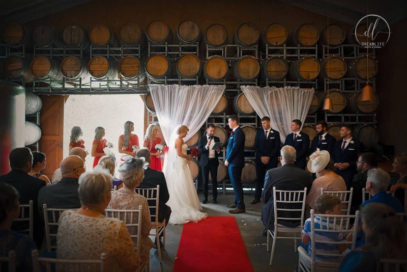 wedding ceremony venue with barrels backdrop